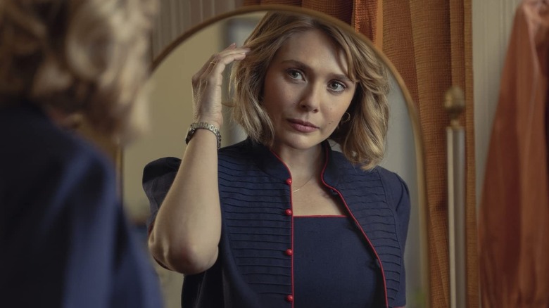 Elizabeth Olsen as Candy Montgomery, looking in the mirror in Love and Death