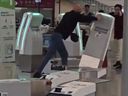 Man knocking over self-serve check-in kiosks at Hong Kong International Airport on Feb. 16, 2026.