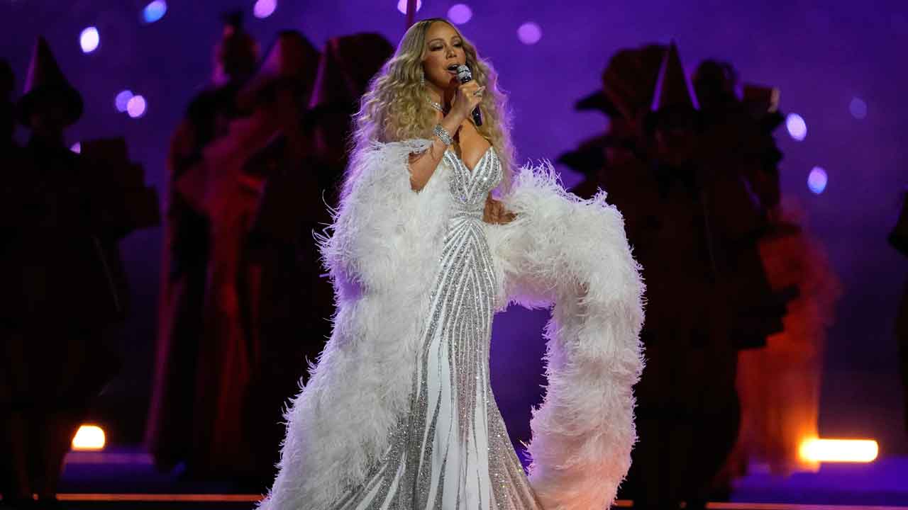 Carey's Olympic act prompts questions about possible lip-syncing and teleprompter