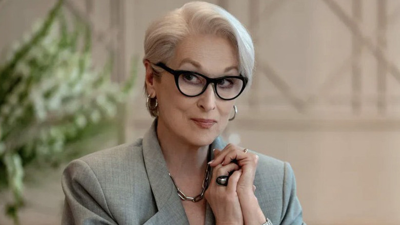 Meryl Streep as Miranda Priestly smirking with her hands together in The Devil Wears Prada 2
