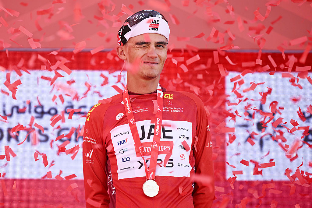 ABU DHABI, UNITED ARAB EMIRATES - FEBRUARY 16: Isaac Del Toro of Mexico and UAE Team Emirates - XRG celebrates at podium as Red Leader Jersey winner during the 8th UAE Tour 2026, Stage 1 a 144km stage from Madinat Zayed Majlis to Liwa Palace on February 16, 2026 in Abu Dhabi, United Arab Emirates. (Photo by Tim de Waele/Getty Images)