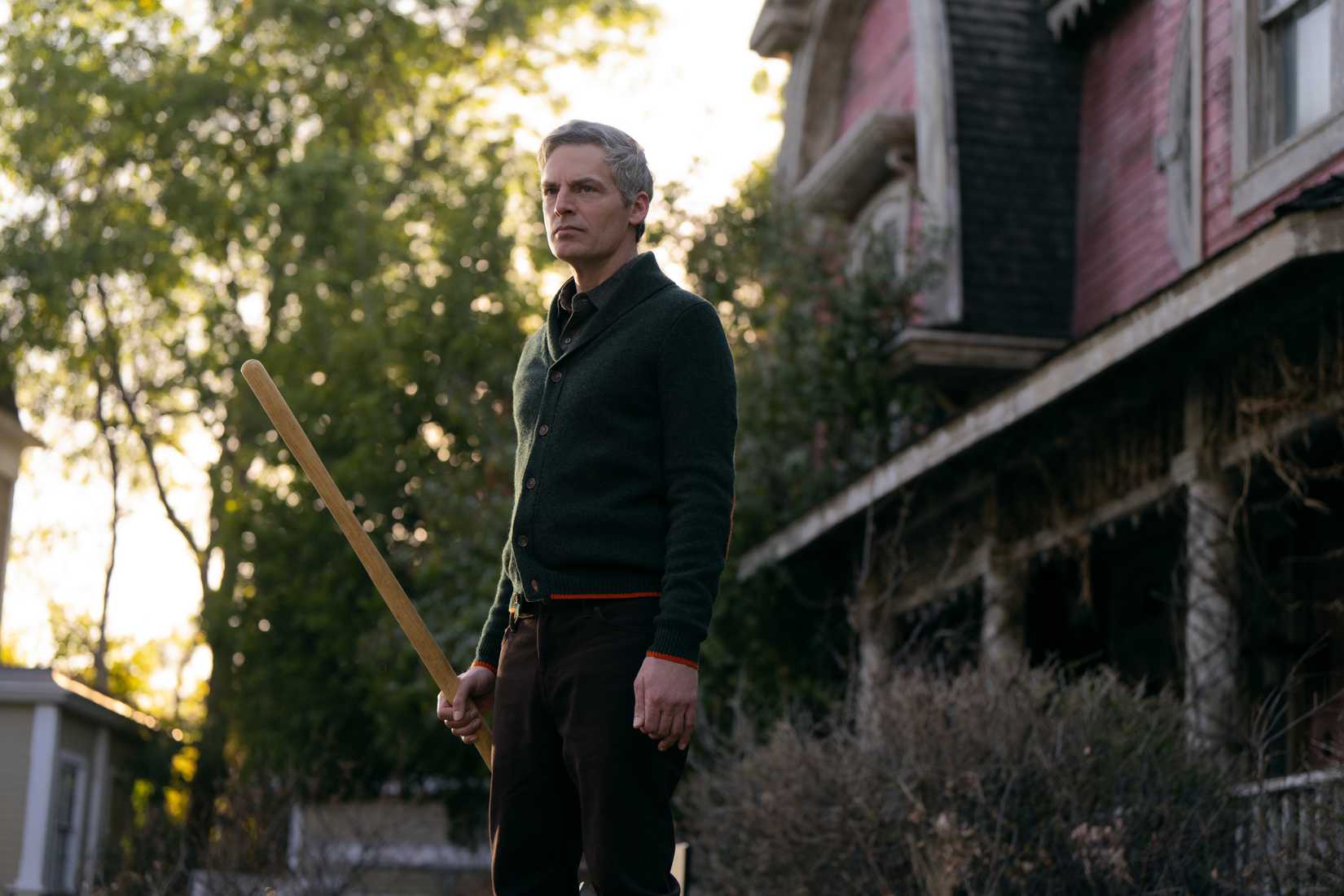 Justin Kirk (Weeds) plays a creepy new neighbor named Gary. Pictured here holding a rake and staring menacingly