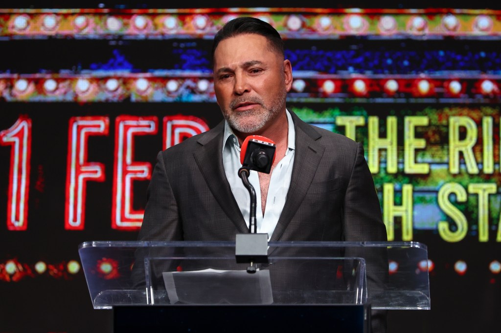 Oscar De La Hoya speaking at a press conference.