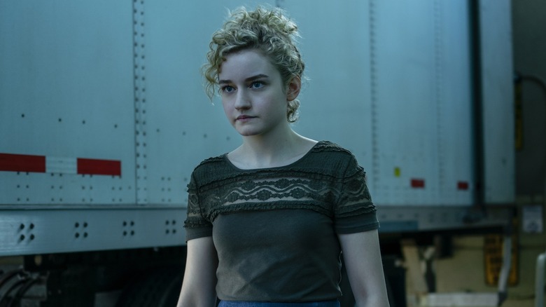 Ruth Langmore (Julia Garner) stands by a truck container in Ozark