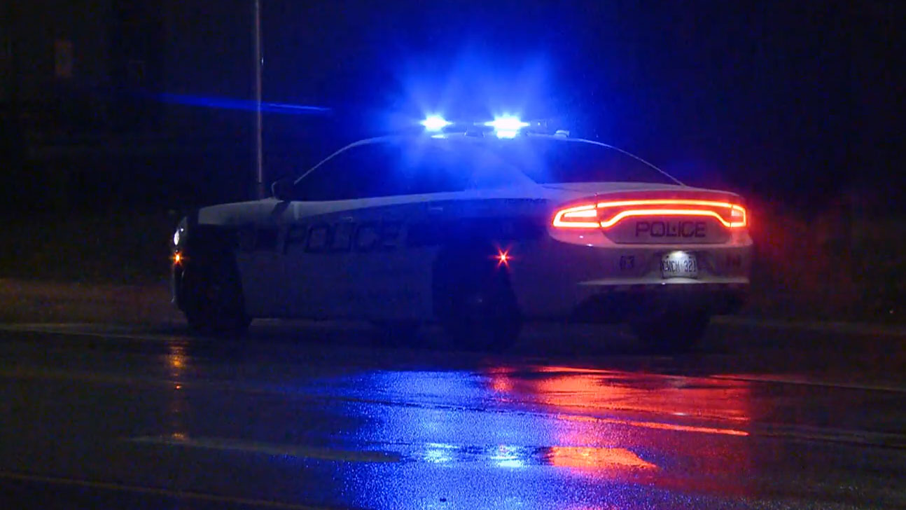 Police officers investigate a two-car crash at Mississauga Road and Beaverbrook Way.