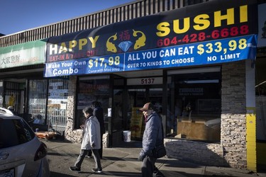 Happy Sushi (5137 Victoria Drive) packs a lot of info into its sign.