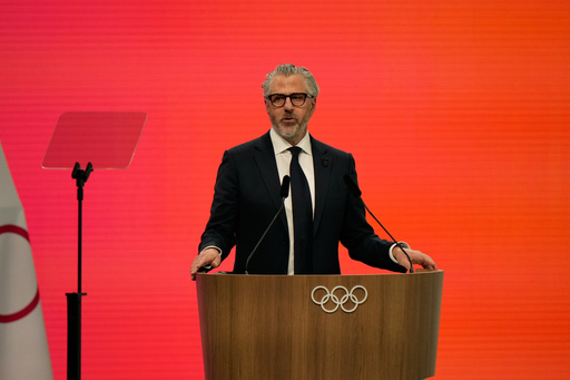 Casey Wasserman, Chairman of the Los Angeles Organizing Committee for the 2028 Olympic and Paralympic Games speaks during an IOC meeting ahead of the 2026 Winter Olympics, in Milan, Italy, Tuesday, Feb. 3, 2026. (AP Photo/Luca Bruno)