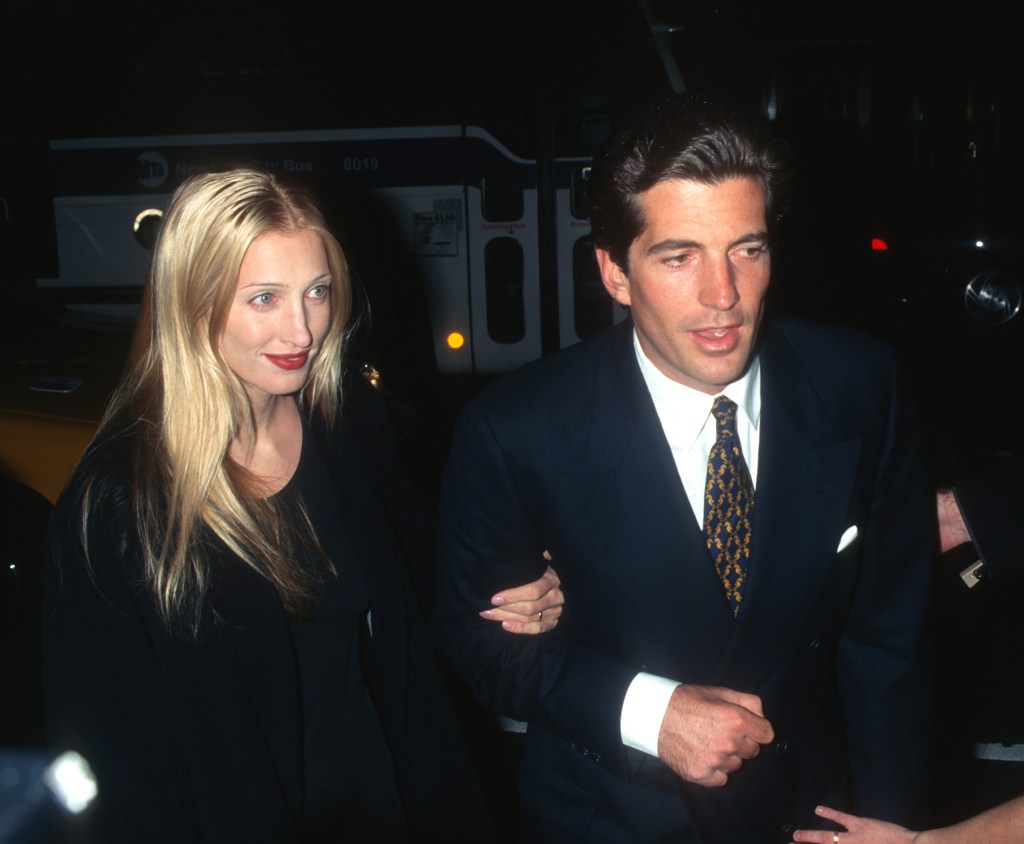 Publicist Carolyn Bessette-Kennedy and publisher John F. Kennedy Jr. arm-in-arm at George magazine's anniversary party.