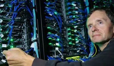Randall Sobie stands in front of UVic’s Arbutus supercomputing infrastructure.