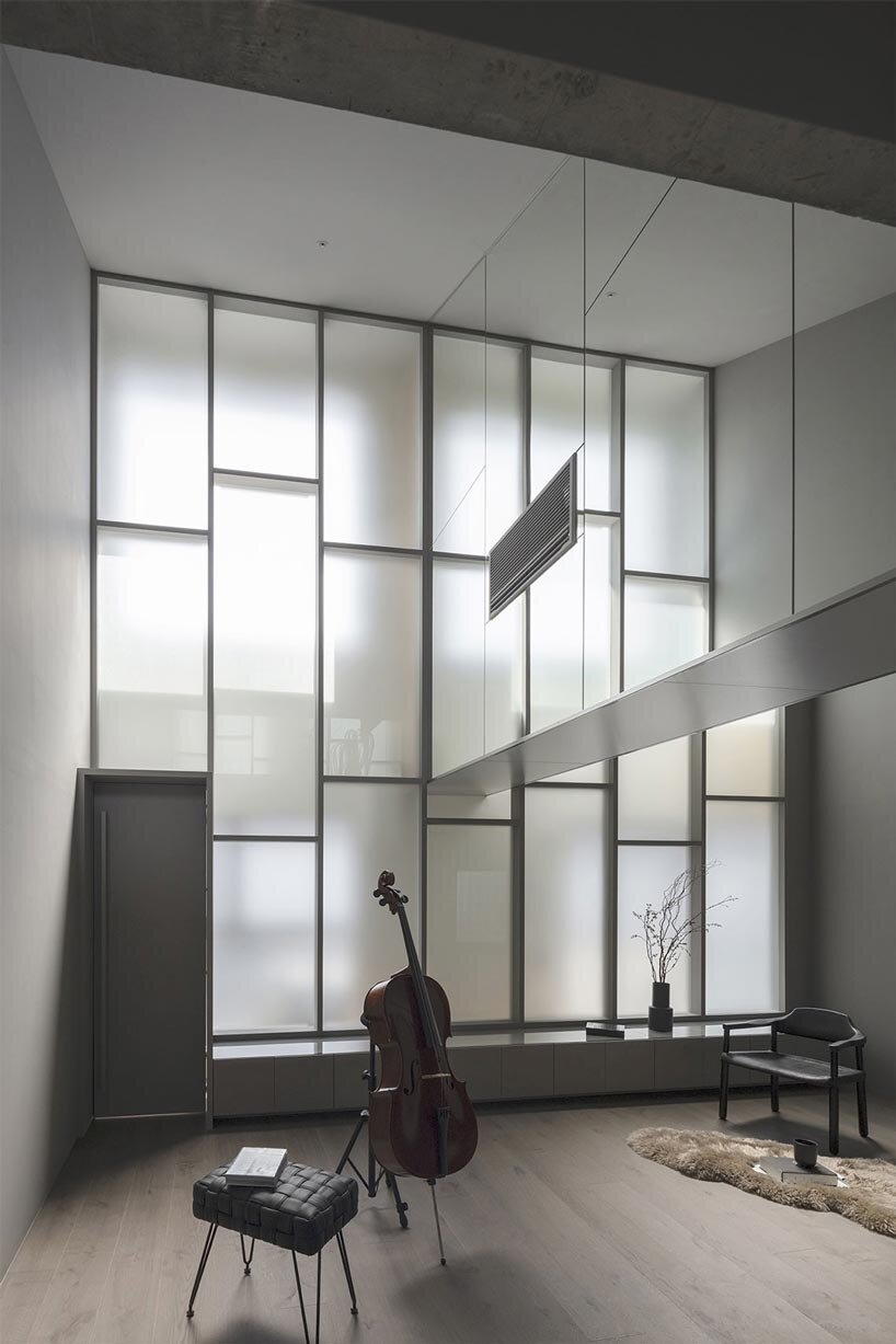 geometric frosted glass screens filter daylight within renovated room 1101 osaka apartment