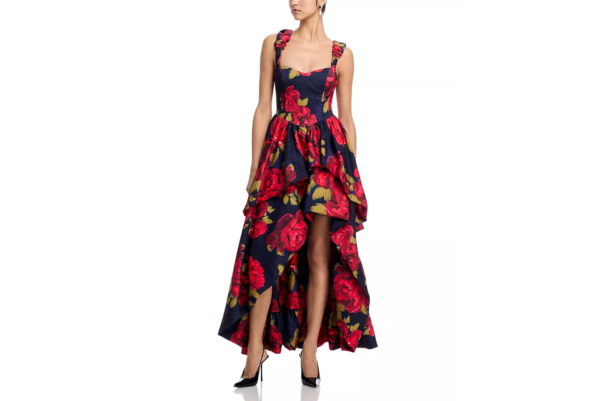A model wearing a navy blue high-low dress with a red and green rose pattern.