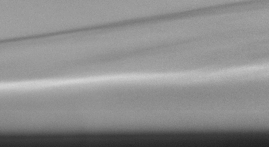 A shock wave interacting with a thin layer of fluid at Mach 10 in a wind tunnel, as captured by the Self-Aligned Focusing Schlieren (SAFS) system invented in 2020 by researchers at NASA’s Langley Research Center in Hampton, Virginia. Compared to conventional Schlieren imaging it eliminates irrelevant features such astunnel boundary layers, off-plane shockwaves, and flow structures from temperature variations outside the wind tunnel.