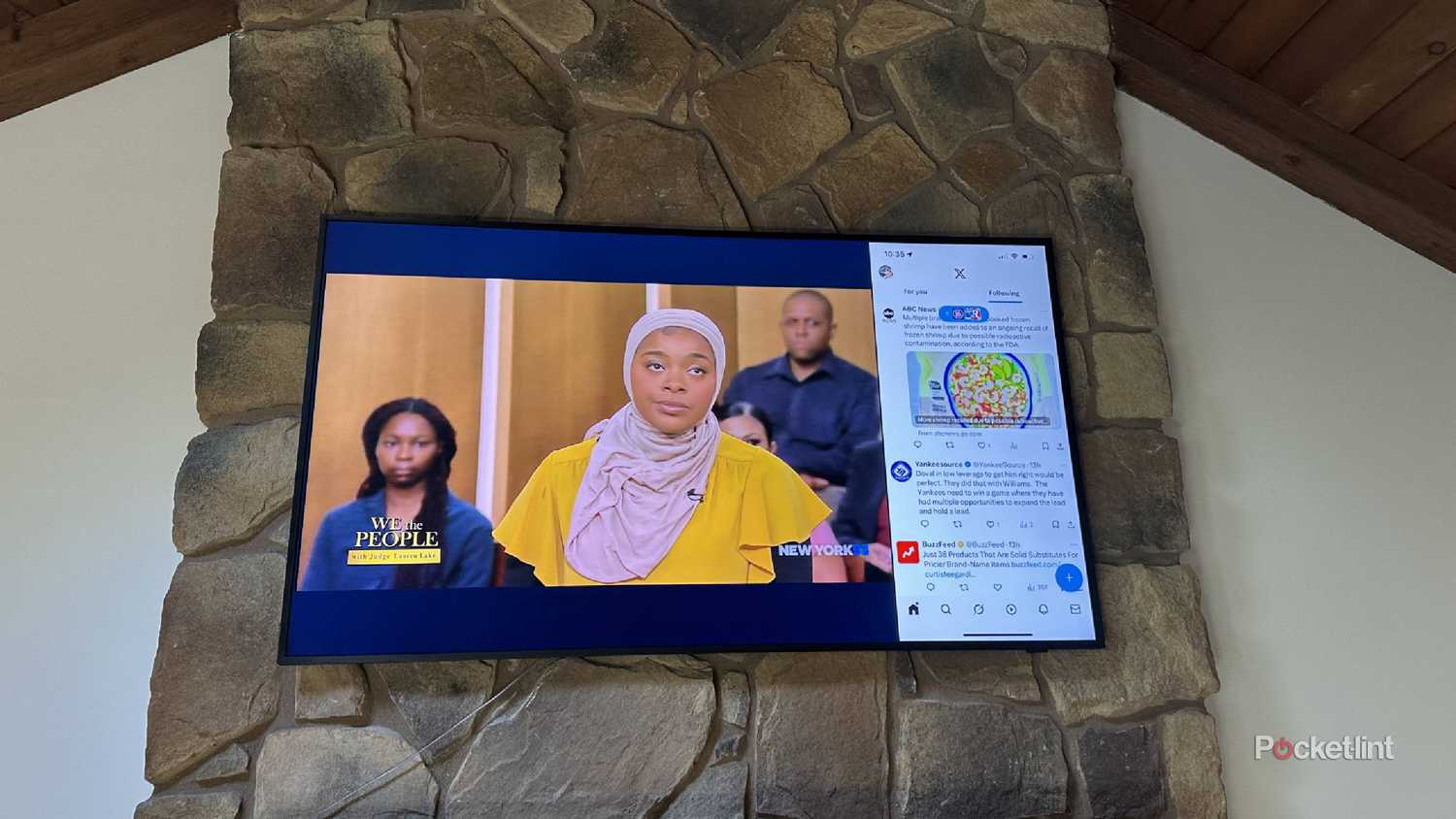 An iPhone screen mirrored on a smart TV, including a TV show.