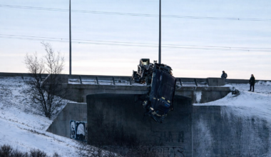 East Perimeter closed as truck hangs off overpass