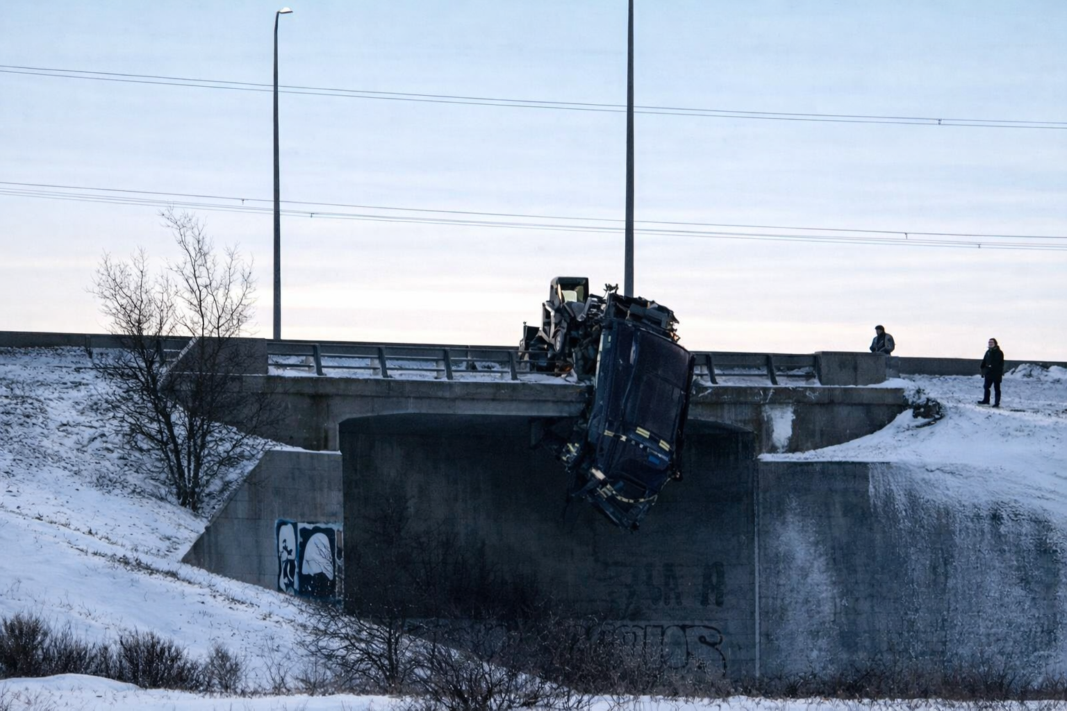 East Perimeter closed as truck hangs off overpass