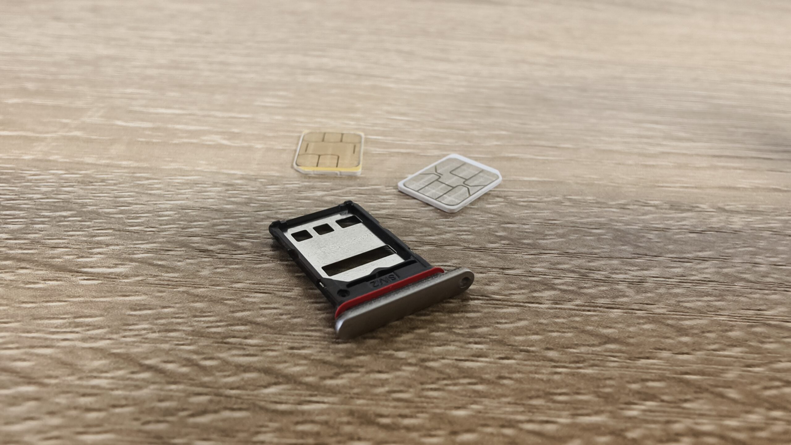 sim cards on a table with a sim tray