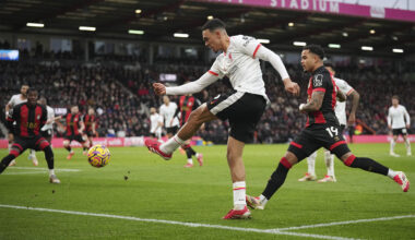 Trent Alexander-Arnold, a player for the Liverpool soccer team in Engalnd, kicking the ball on the pitch during a game.