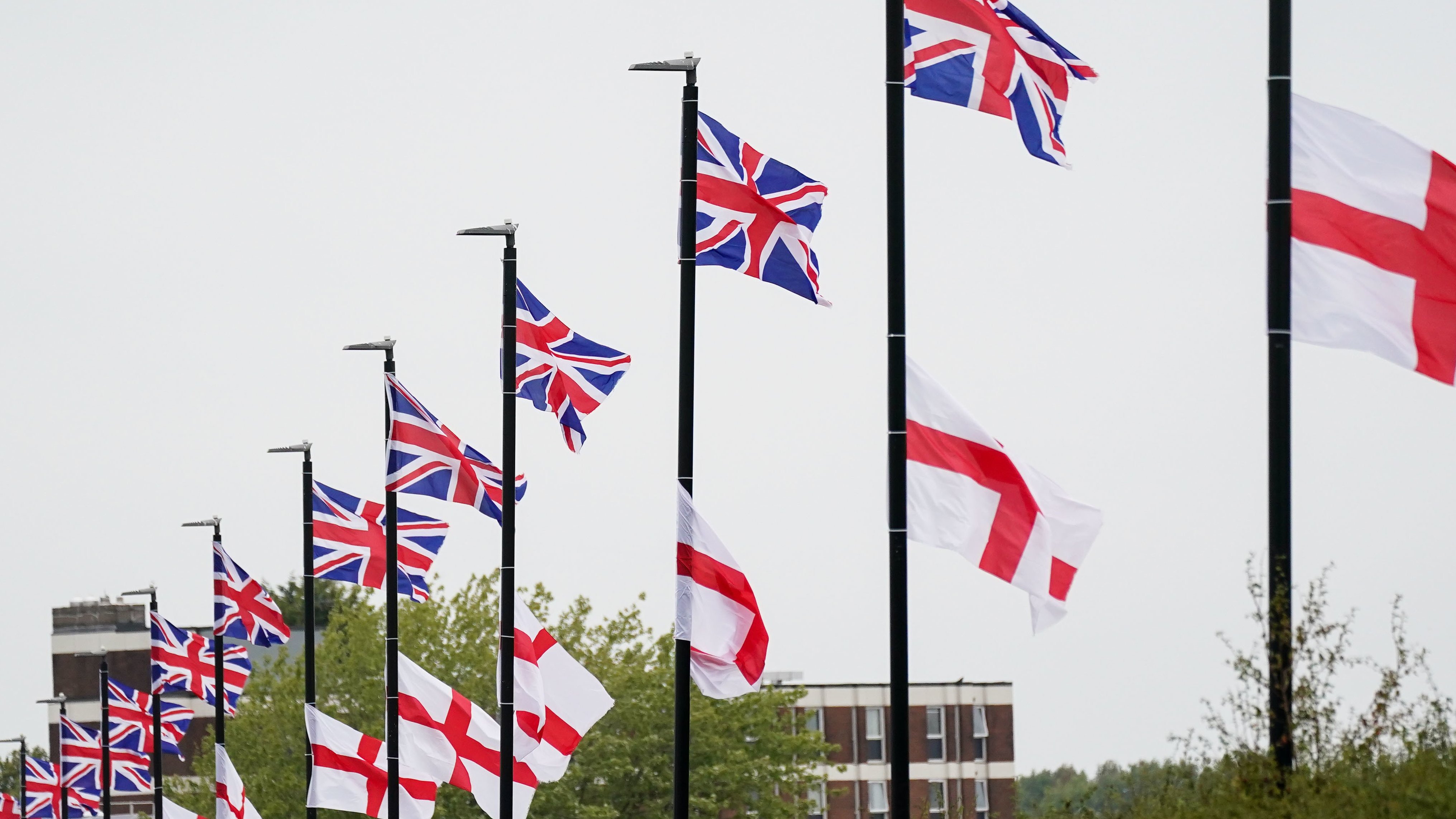 St George's and Union Flags fly by a roadside