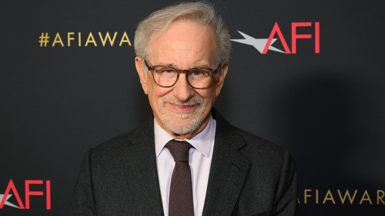 Steven Spielberg smiling and wearing a suit