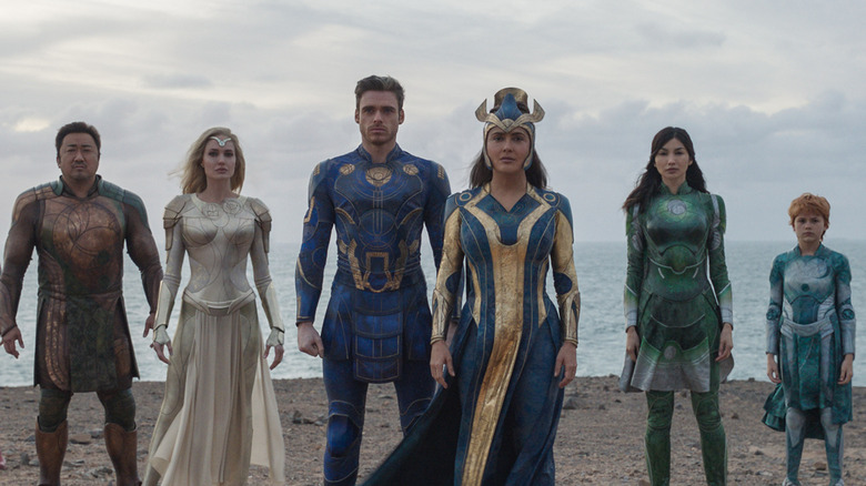 The Eternals standing on a beach in 
