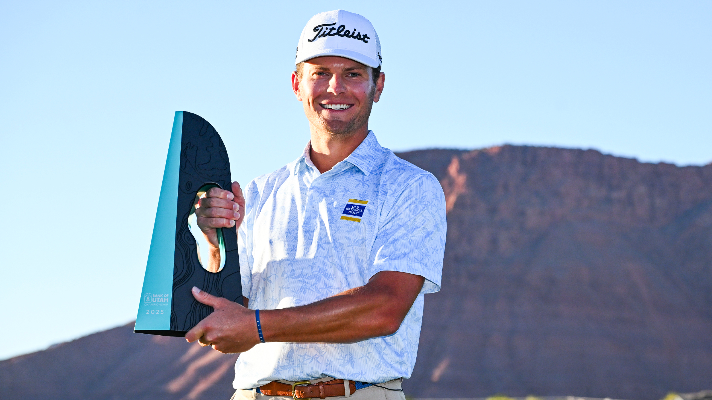 Michael Brennan with the Bank of Utah Championship trophy