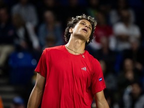 Canada's Gabriel Diallo reacts to losing a game to Brazil's Gustavo Heide during the third set of a Davis Cup Qualifiers tennis singles match in Vancouver, on Friday, Feb. 6, 2026.