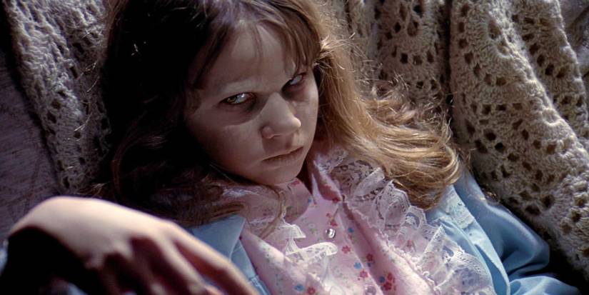 Linda Blair as a possessed Regan seated in 'The Exorcist'.