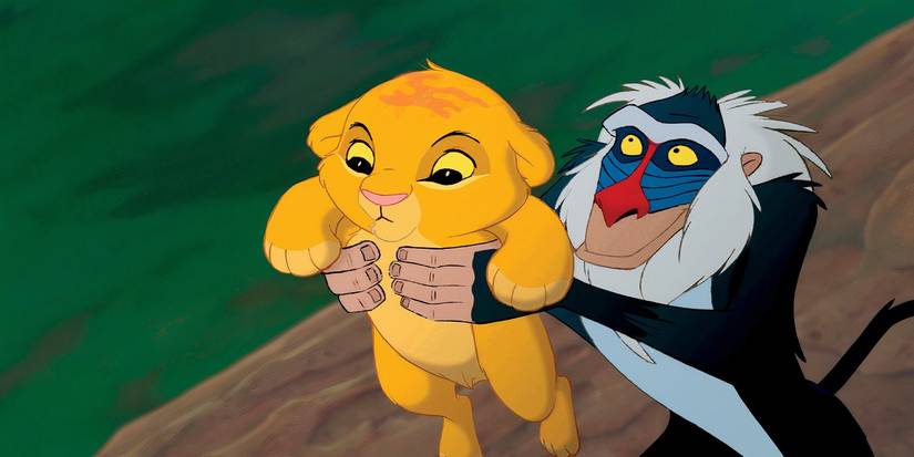 Rafiki holds a baby Simba in The Lion King