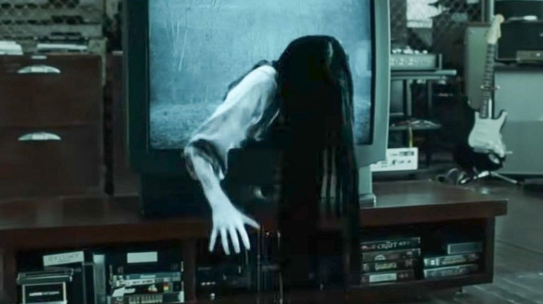 Daveigh Chase as Samara, attempting to turn off motion smoothing on a tv in The Ring
