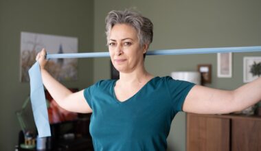 If you work at a desk, a Pilates teacher recommends these three yoga strap moves to loosen up hunched shoulders