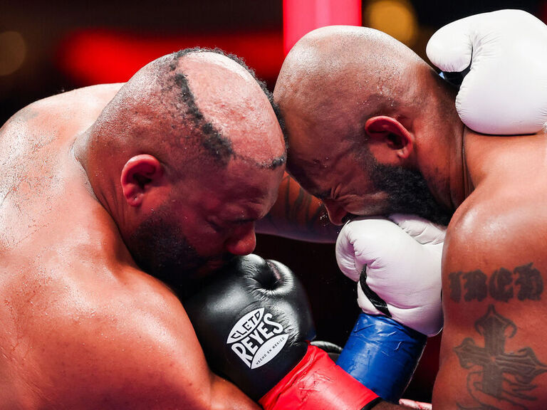 Miller has toupee knocked off head during fight