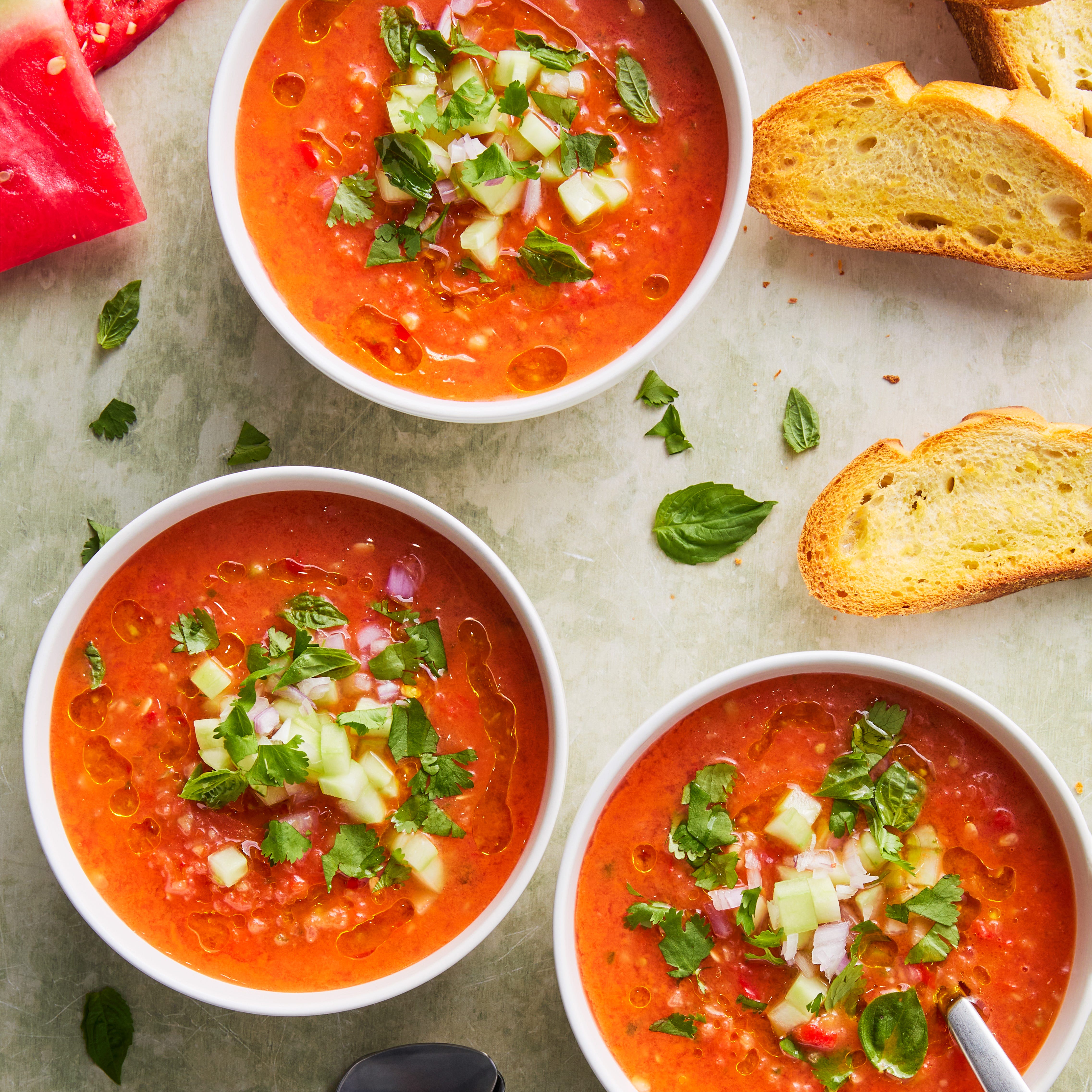 watermelon gazpacho topped with cucumber and red onion