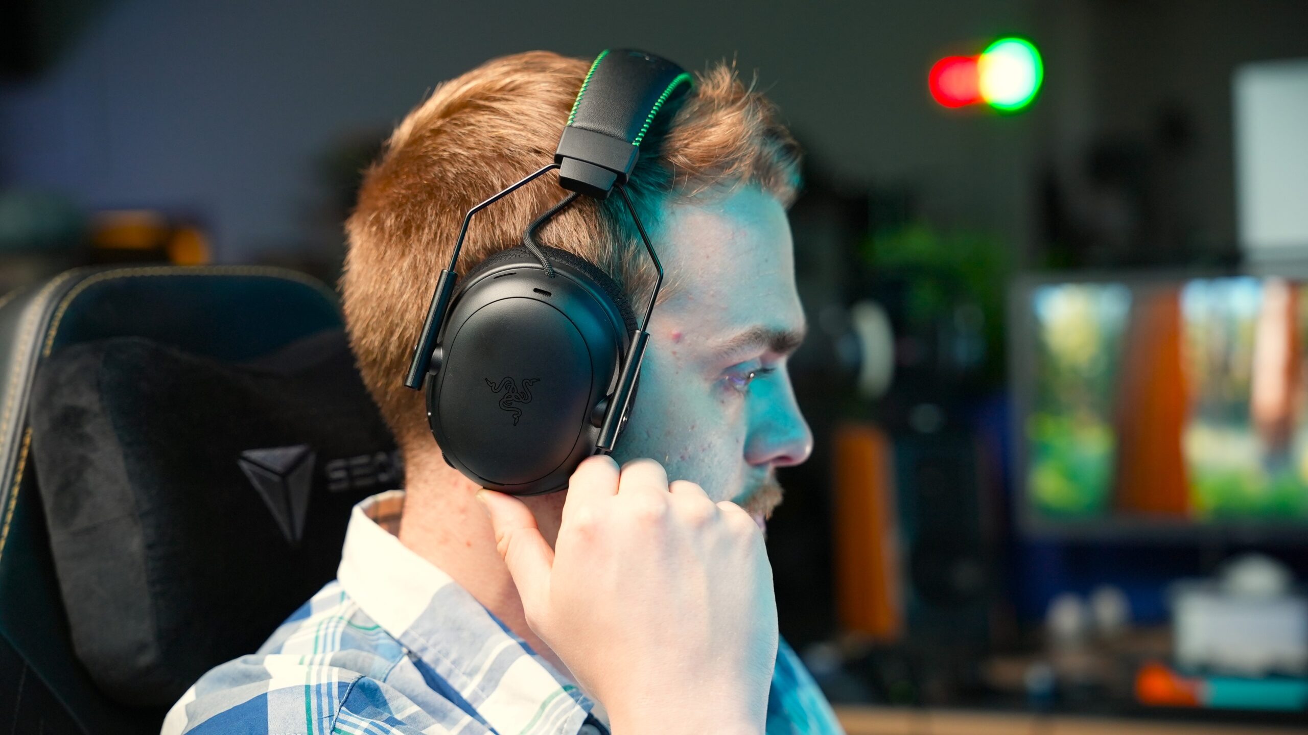 a man wearing razer blackshark v3 pro