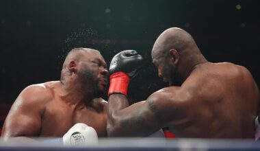 Boxer Jarrell Miller has hairpiece knocked upward by punch, throws it into the crowd