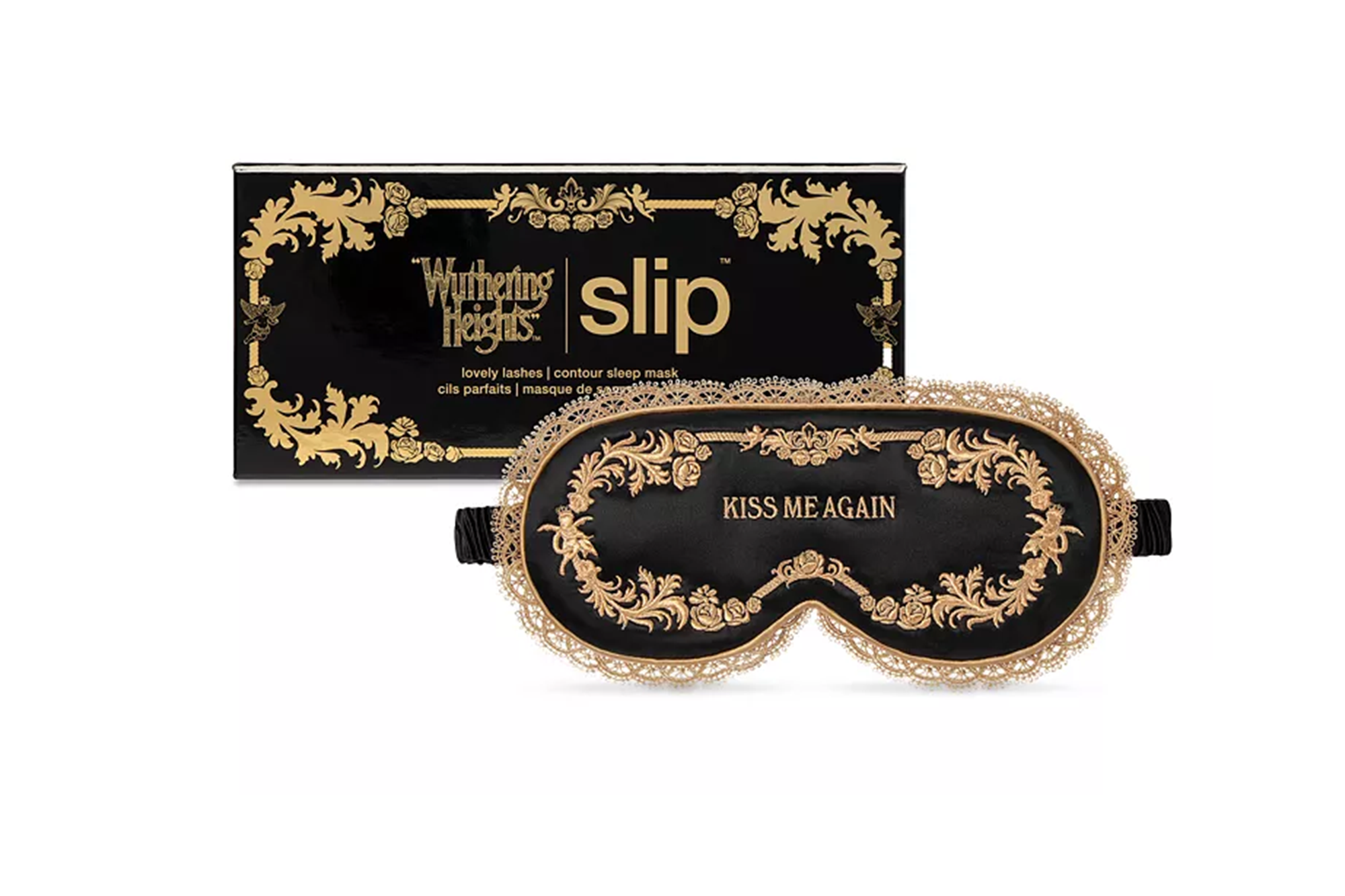 Black sleep mask with gold filigree and "KISS ME AGAIN" text, next to its black and gold "Wuthering Heights" themed box.