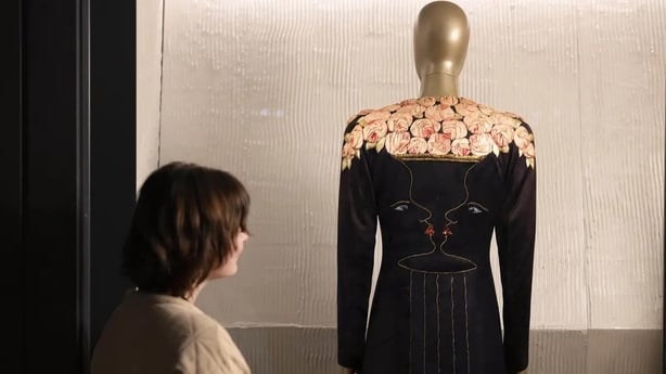 A silk evening coat made by Elsa Schiaparelli with embroidered drawings by Jean Cocteau