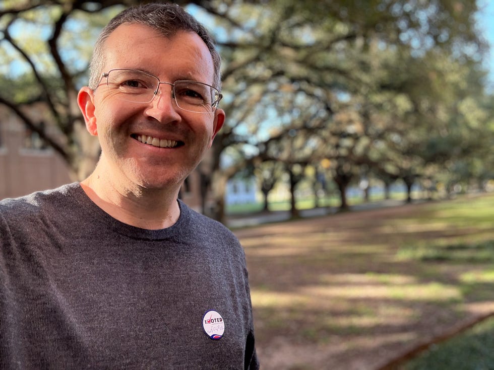 tony alvarado taking a selfie in the park.