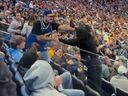 Two fans traded punches in the stands during the NBA game between the Milwaukee Bucks and Golden State Warriors.