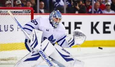 Feb 2, 2026; Calgary, Alberta, CAN; Toronto Maple Leafs goaltender Joseph Woll (60) makes a save against the Calgary Flames during the second period at Scotiabank Saddledome. Mandatory Credit: Sergei Belski-Imagn Images