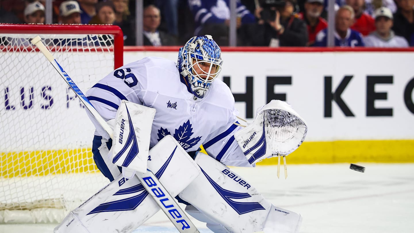 Feb 2, 2026; Calgary, Alberta, CAN; Toronto Maple Leafs goaltender Joseph Woll (60) makes a save against the Calgary Flames during the second period at Scotiabank Saddledome. Mandatory Credit: Sergei Belski-Imagn Images