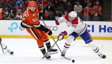 Mar 6, 2026; Anaheim, California, USA;  Anaheim Ducks right wing Beckett Sennecke (45) fights for the puck against Montreal Canadiens defenseman Noah Dobson (53) during the second period at Honda Center. Mandatory Credit: Kiyoshi Mio-Imagn Images