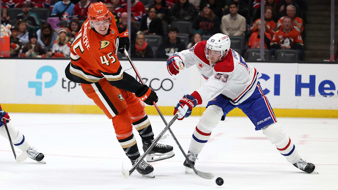 Mar 6, 2026; Anaheim, California, USA;  Anaheim Ducks right wing Beckett Sennecke (45) fights for the puck against Montreal Canadiens defenseman Noah Dobson (53) during the second period at Honda Center. Mandatory Credit: Kiyoshi Mio-Imagn Images