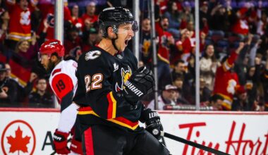 Mar 7, 2026; Calgary, Alberta, CAN; Calgary Flames center Ryan Strome (22) scores a goal against the Carolina Hurricanes during the second period at Scotiabank Saddledome. Mandatory Credit: Sergei Belski-Imagn Images
