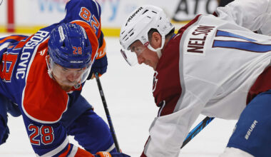 Nov 8, 2025; Edmonton, Alberta, CAN; Edmonton Oilers /218/ and Colorado Avalanche forward Brock Nelson (11) battle during a face-off in the first period at Rogers Place. Mandatory Credit: Perry Nelson-Imagn Images