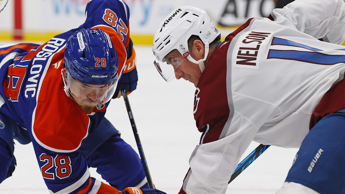 Nov 8, 2025; Edmonton, Alberta, CAN; Edmonton Oilers /218/ and Colorado Avalanche forward Brock Nelson (11) battle during a face-off in the first period at Rogers Place. Mandatory Credit: Perry Nelson-Imagn Images