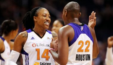 Sep. 16, 2012; Phoenix, AZ, USA; Phoenix Mercury guard Alexis Hornbuckle (14) reacts with teammate forward Charde Houston (22) during the game against the Chicago Sky in the second half at the US Airways Center.  The Sky defeated the Mercury 86-55. Mandatory Credit: Jennifer Stewart-Imagn Images
