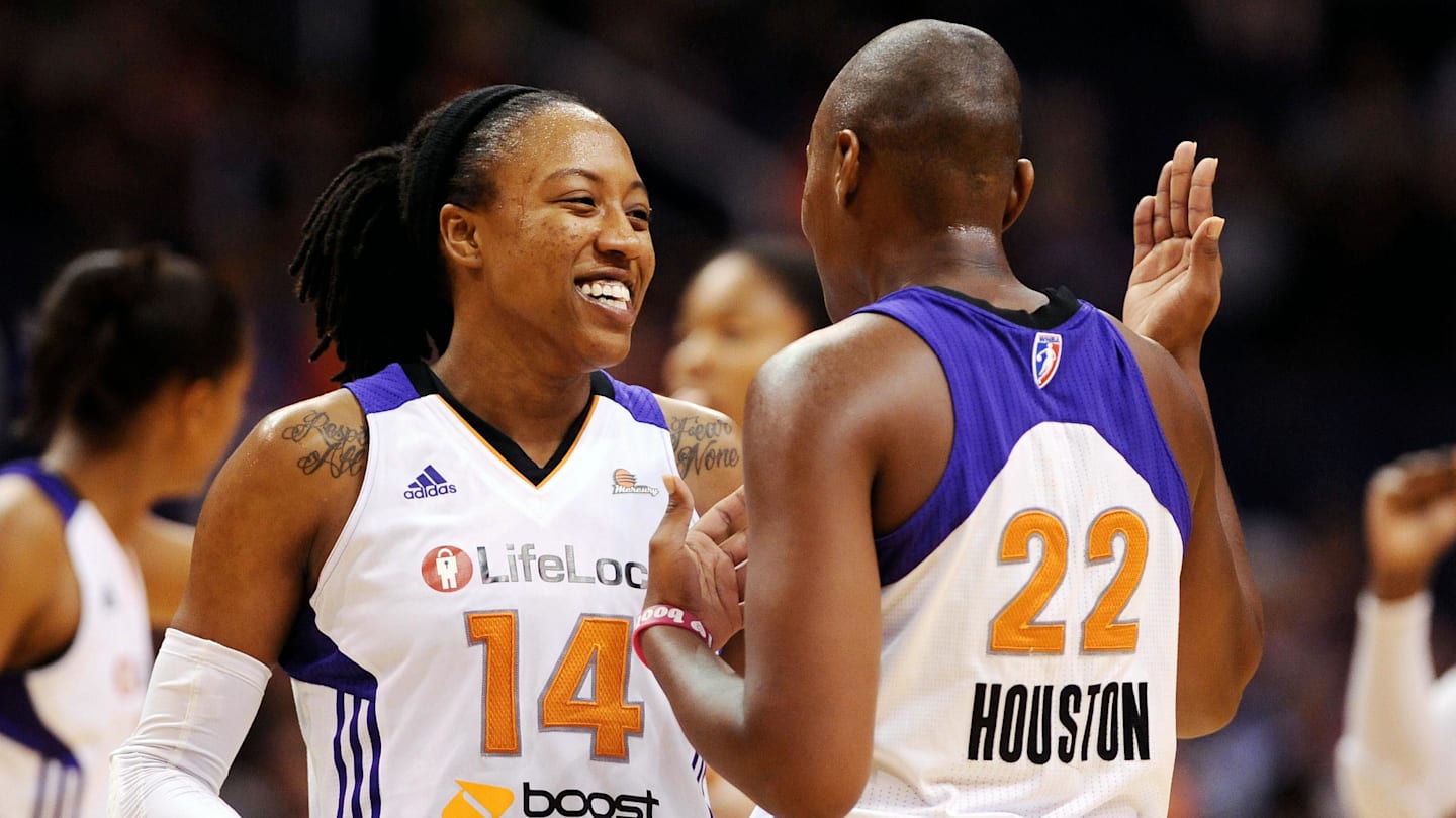 Sep. 16, 2012; Phoenix, AZ, USA; Phoenix Mercury guard Alexis Hornbuckle (14) reacts with teammate forward Charde Houston (22) during the game against the Chicago Sky in the second half at the US Airways Center.  The Sky defeated the Mercury 86-55. Mandatory Credit: Jennifer Stewart-Imagn Images