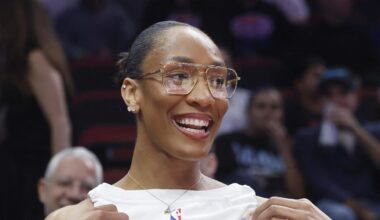 Nov 19, 2025; Miami, Florida, USA; WNBA player A'ja Wilson shows off her Miami Heat Bam Adebayo jersey before the game between the Miami Heat and the Golden State Warriors at Kaseya Center. Mandatory Credit: Rhona Wise-Imagn Images