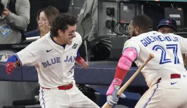 Nov 1, 2025; Toronto, Ontario, CAN; Toronto Blue Jays third baseman Ernie Clement (22) celebrates with first baseman Vladimir Guerrero Jr. (27) after scoring against the Los Angeles Dodgers in the sixth inning during game seven of the 2025 MLB World Series at Rogers Centre. Mandatory Credit: Kevin Sousa-Imagn Images