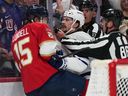Florida Panthers centre Anton Lundell and Toronto Maple Leafs defenceman Oliver Ekman-Larsson scuffle during Thursday's game.